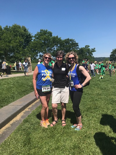 Tracey outside with her friends Arianna and Kristy wearing sarcoma awareness t-shirts at a race for awareness for sarcoma 